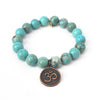 10mm Bright Blue Turquoise Bracelet with an Om Charm